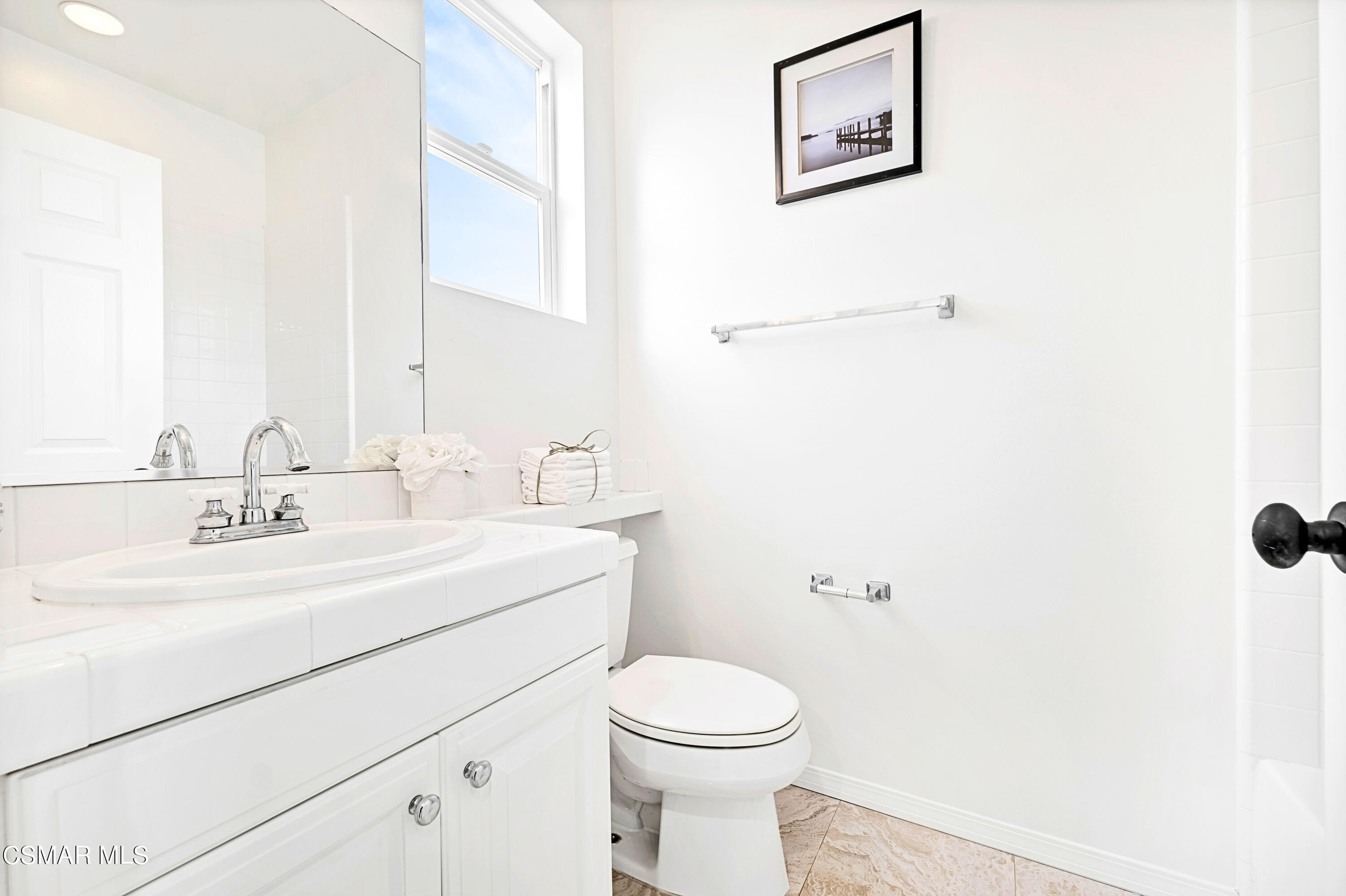 6196 Deerhill Road Oak Park, CA 91377 - Photo 24 of 46 a bathroom with a toilet sink and mirror