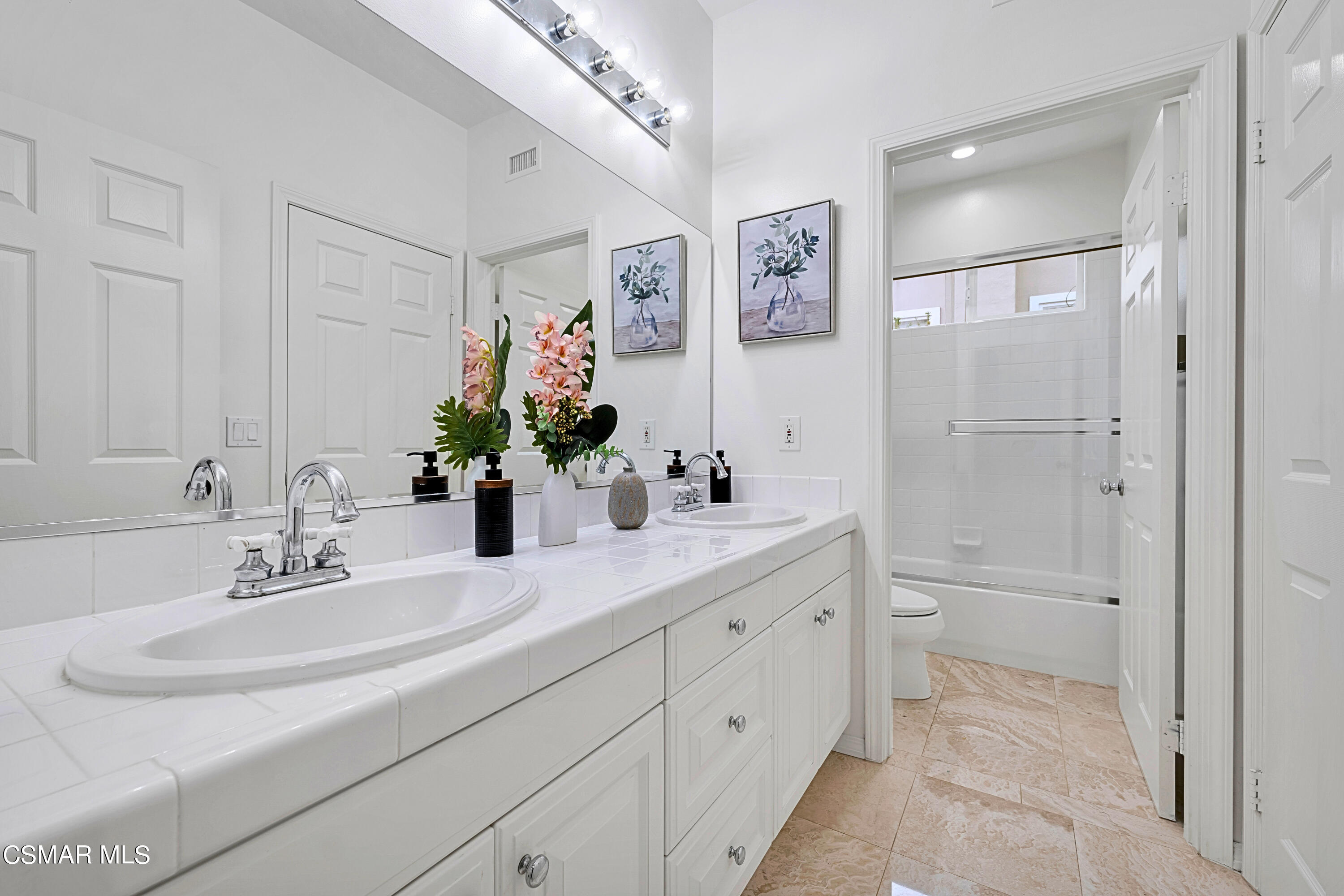6196 Deerhill Road Oak Park, CA 91377 - Photo 26 of 46 a bathroom with a sink and a mirror