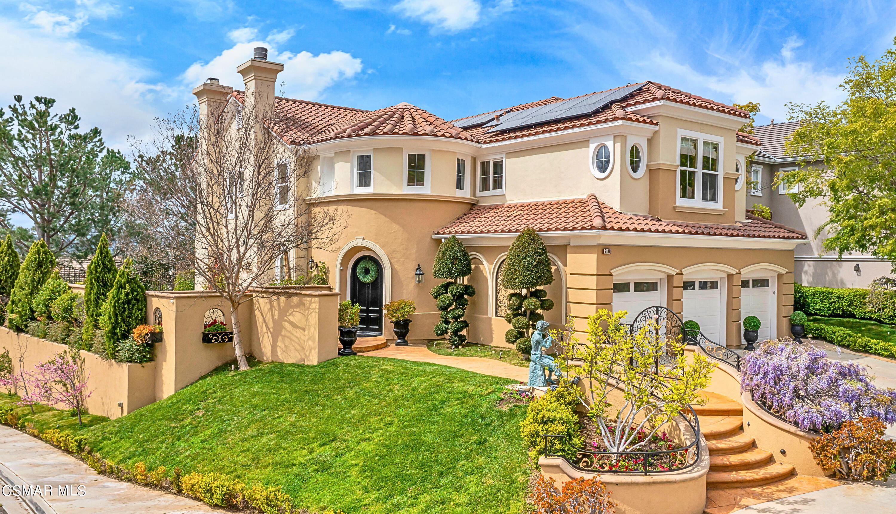 6196 Deerhill Road Oak Park, CA 91377 - Photo 3 of 46 a front view of a house with a yard