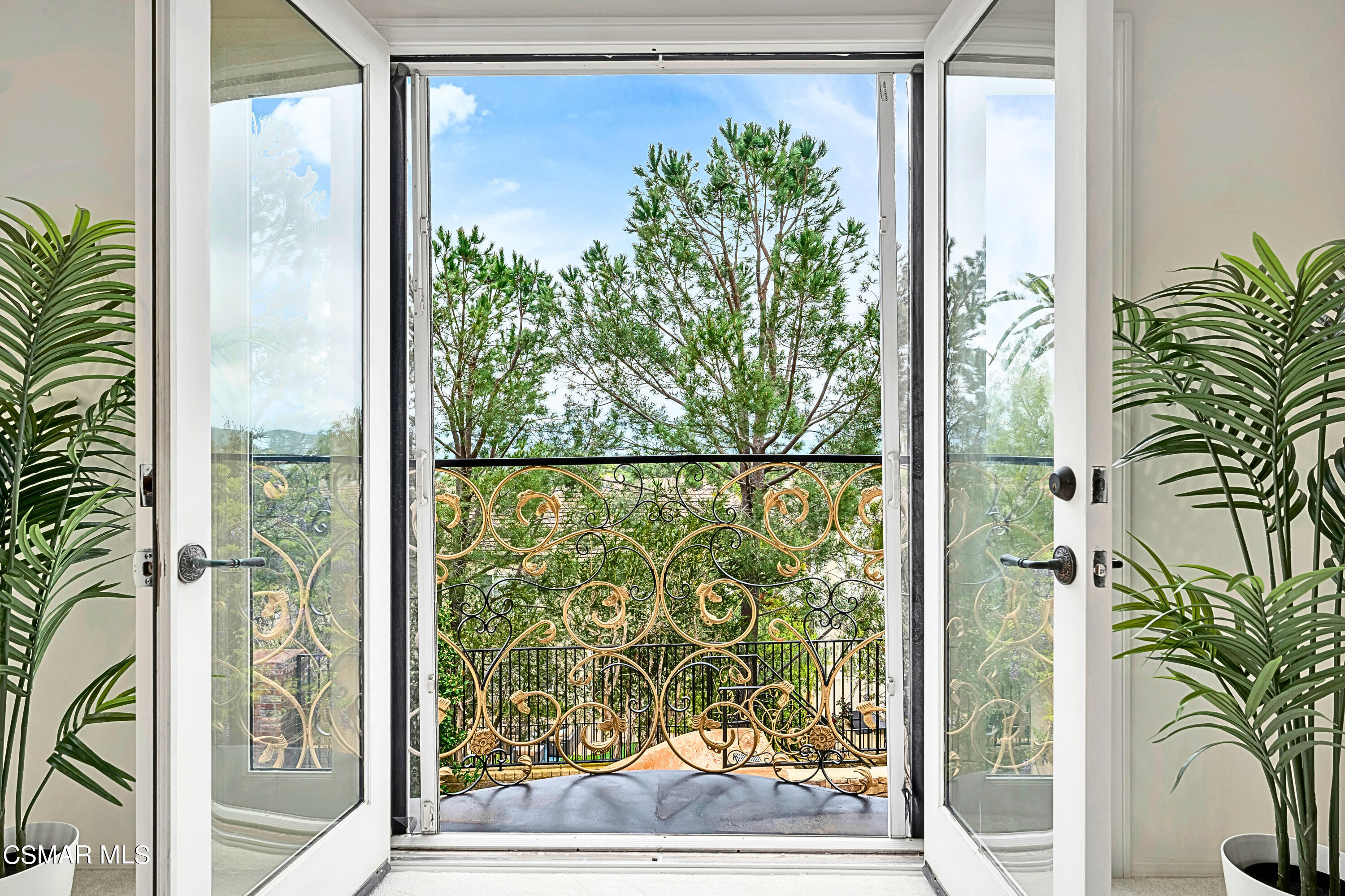 6196 Deerhill Road Oak Park, CA 91377 - Photo 33 of 46 a view of a glass door with a yard