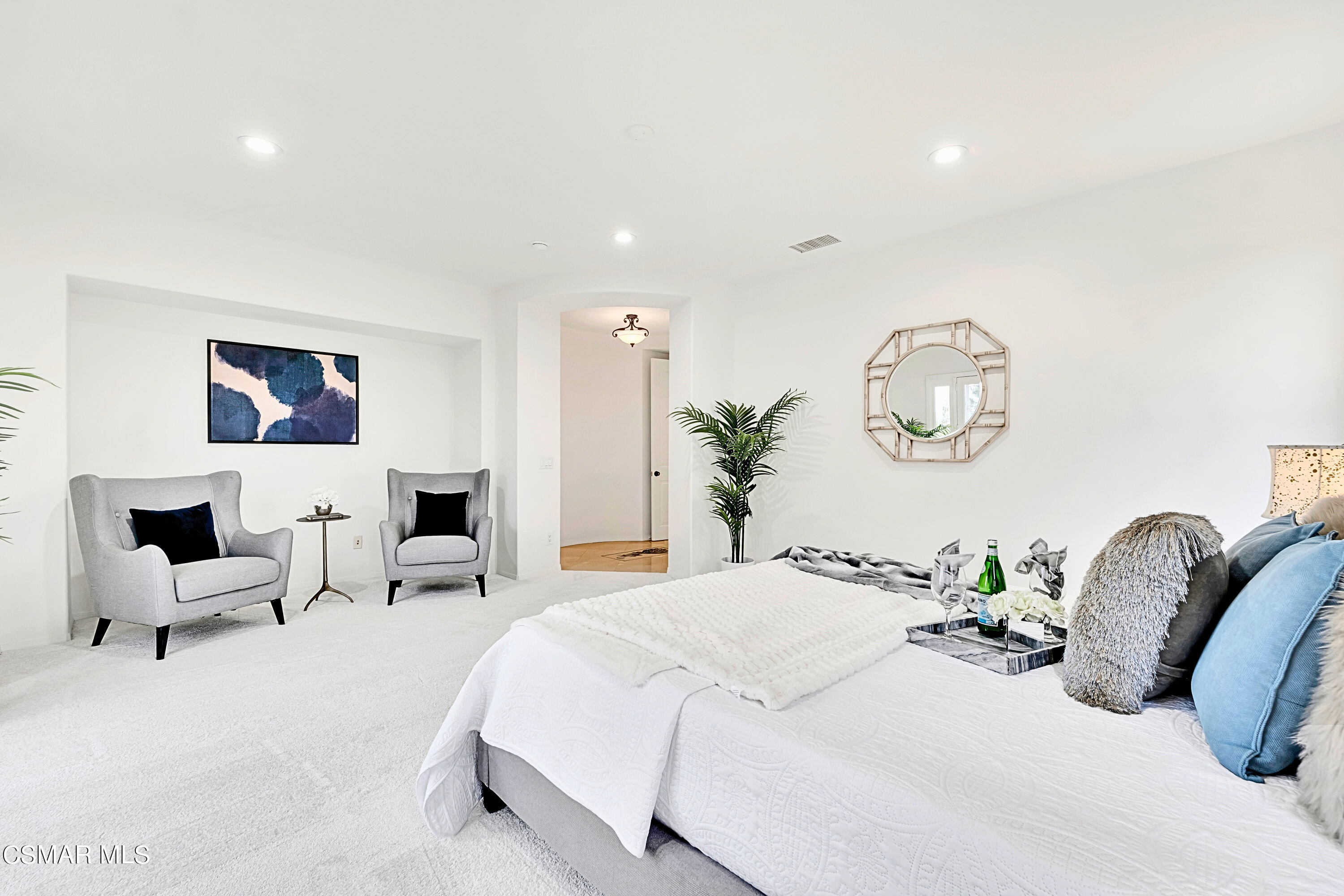 6196 Deerhill Road Oak Park, CA 91377 - Photo 34 of 46 a bedroom with bed and a chandelier