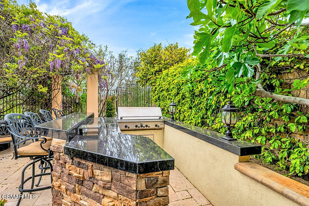 6196 Deerhill Road Oak Park, CA 91377 - Photo 39 of 46 a view of a chairs and table in a balcony