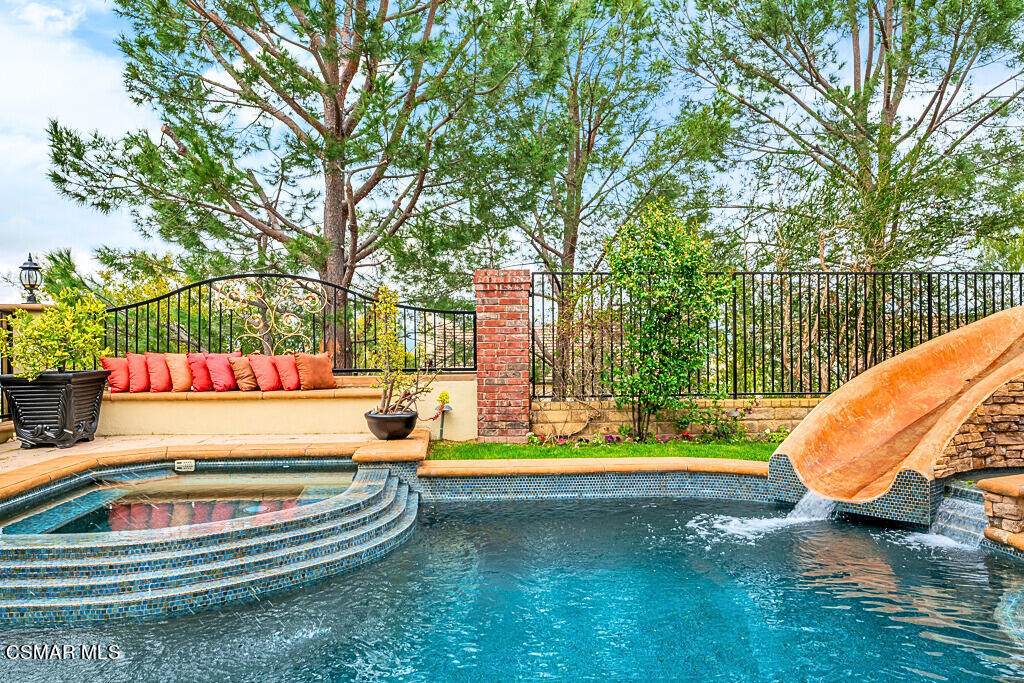 6196 Deerhill Road Oak Park, CA 91377 - Photo 41 of 46 swimming pool view with a garden and trees