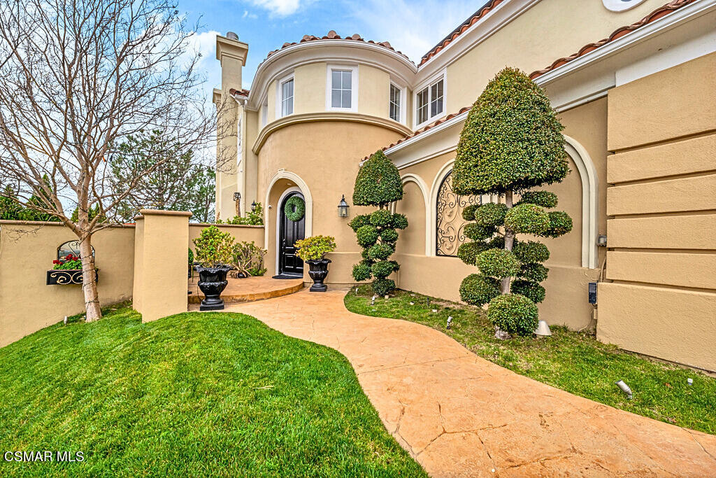 6196 Deerhill Road Oak Park, CA 91377 - Photo 5 of 46 a front view of a house with garden