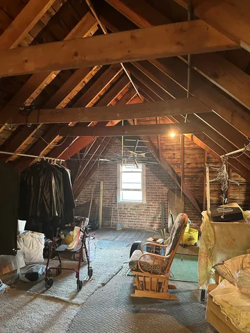 a living room with furniture and a pool table