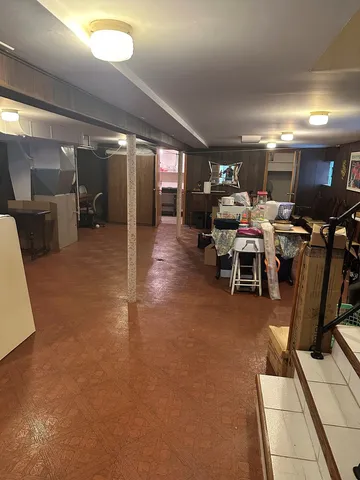 a kitchen with a stove top oven and cabinets
