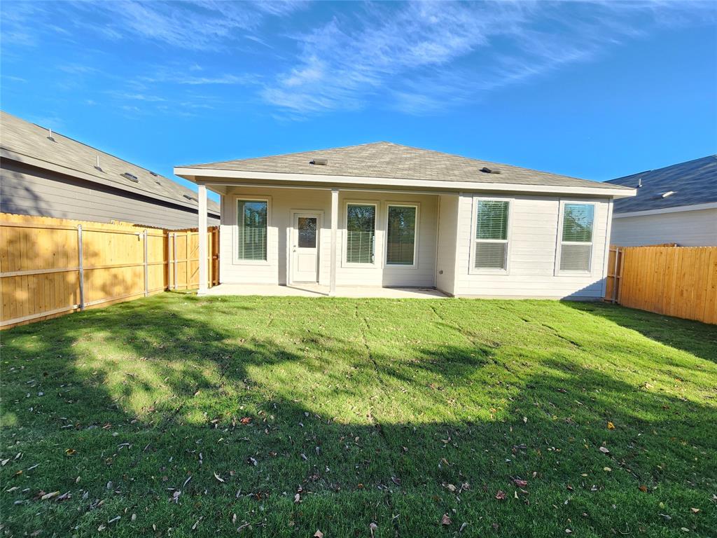 6814 Welsh Drive Princeton, TX 75407 - Photo 15 of 16 a view of a house with a backyard