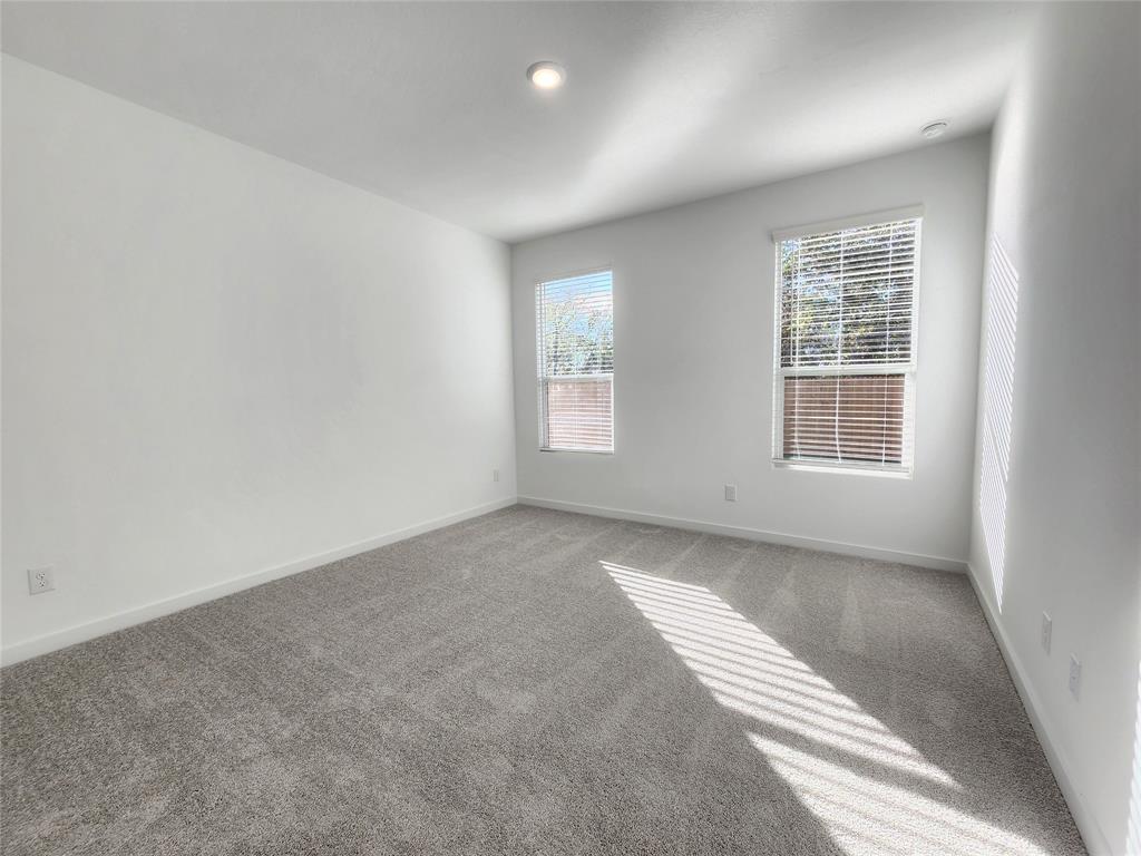 6814 Welsh Drive Princeton, TX 75407 - Photo 7 of 16 an empty room with windows