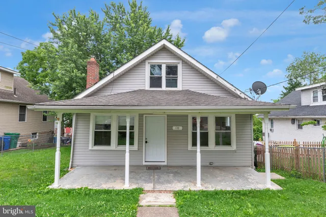 a view of a house with a yard and plants