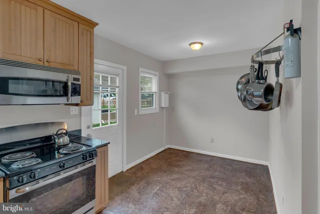 a kitchen with a stove and a microwave