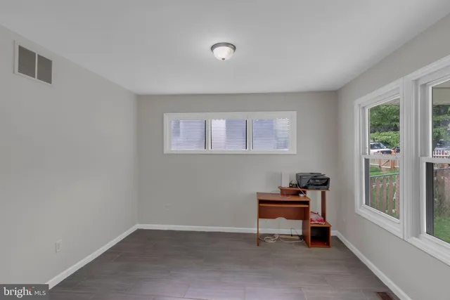 a room with furniture and a window