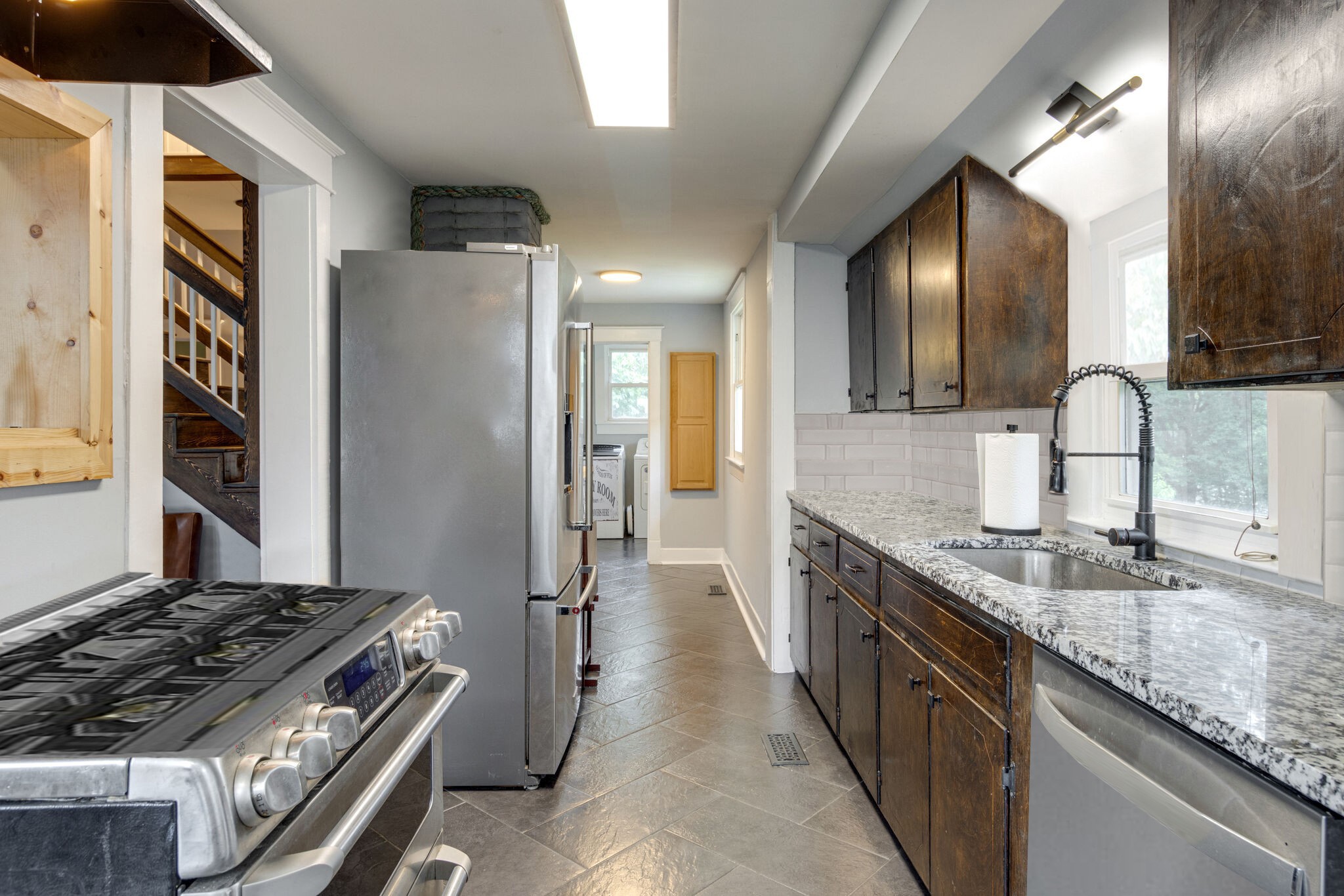 430 Center Avenue Dickson, TN 37055 - Photo 5 of 14 a kitchen with granite countertop a sink stove and refrigerator