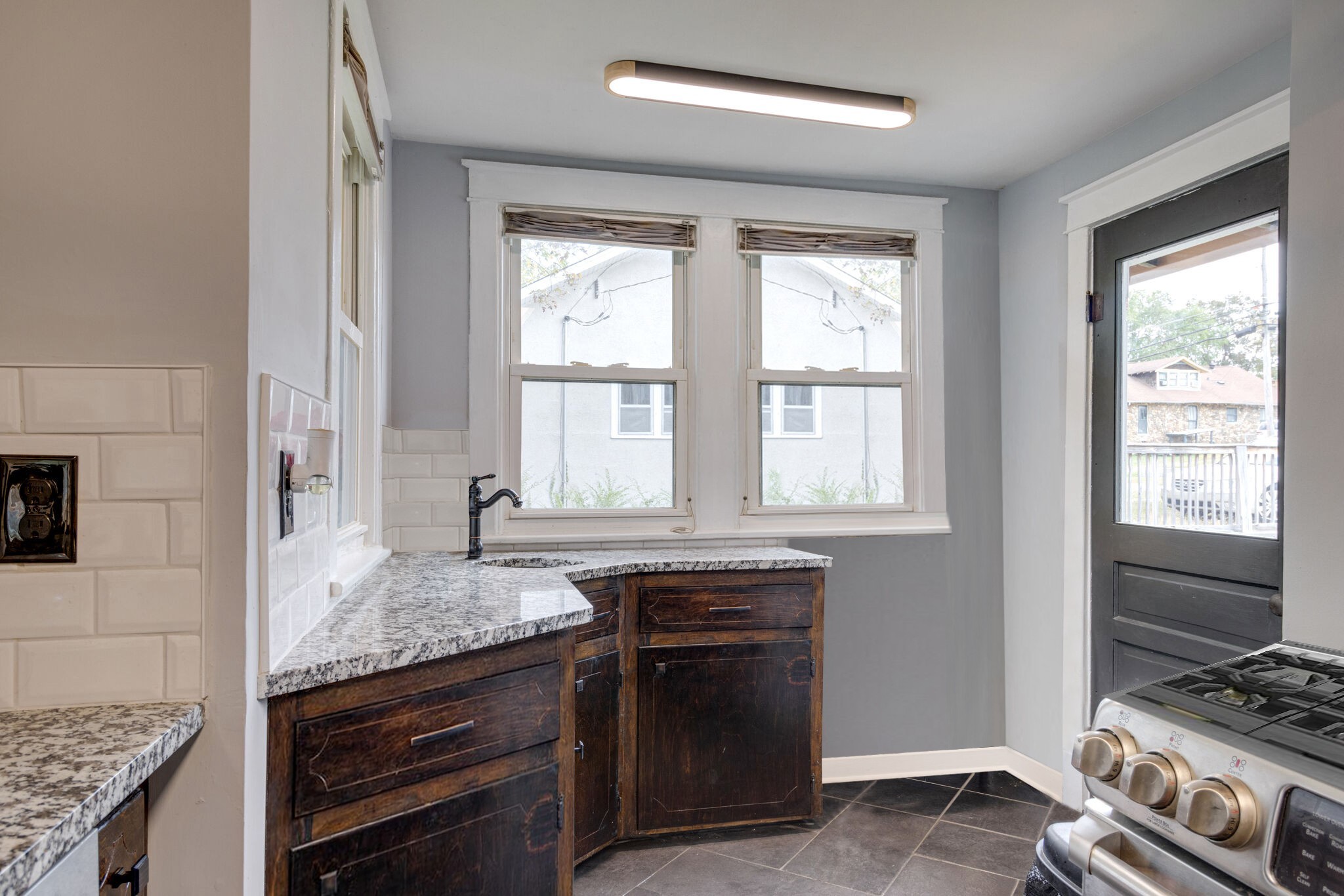 430 Center Avenue Dickson, TN 37055 - Photo 7 of 14 a kitchen with granite countertop a stove and a sink