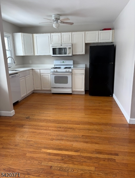 35 Carey Avenue, Unit 19 Butler, NJ 07405 - Photo 3 of 8 a kitchen with stainless steel appliances granite countertop a refrigerator and a stove top oven