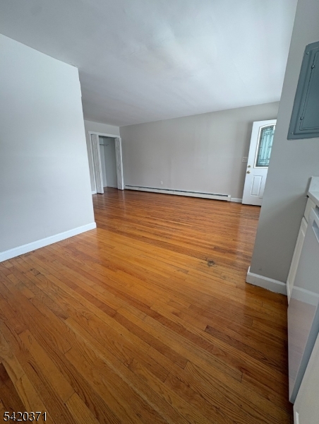 35 Carey Avenue, Unit 19 Butler, NJ 07405 - Photo 7 of 8 wooden floor in an empty room with a window