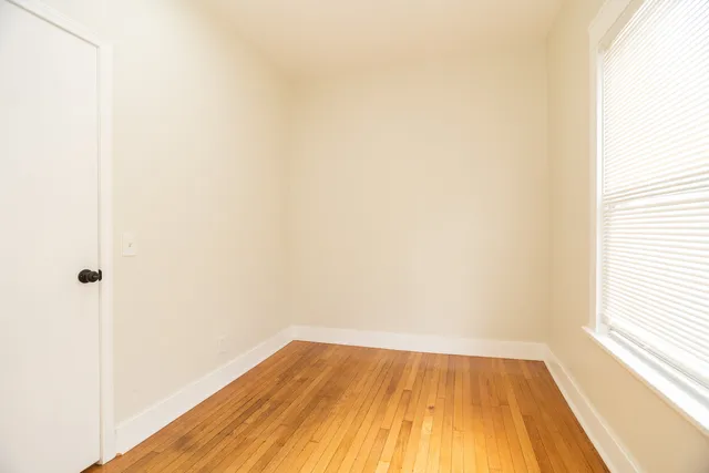a view of a small space with wooden floor