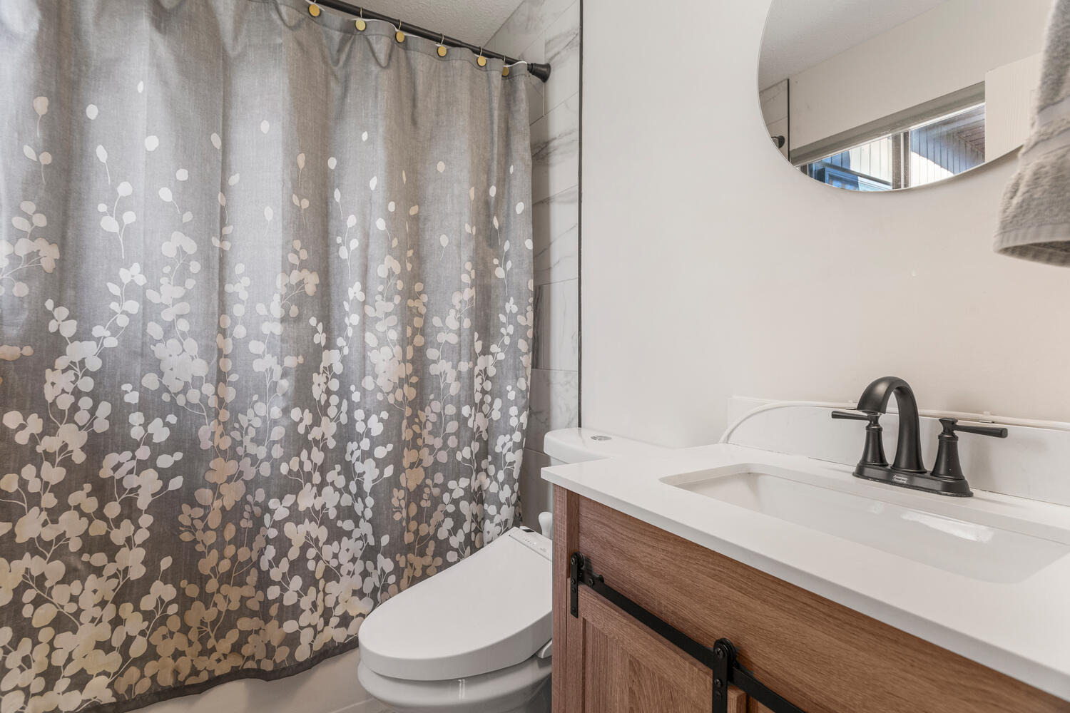 2317 Brookshire East Champaign, IL 61821 - Photo 20 of 32 a bathroom with a sink a toilet and shower curtain
