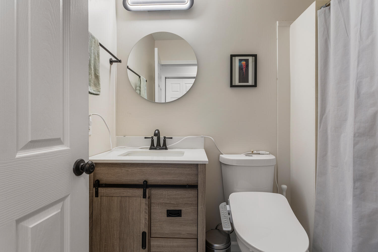 2317 Brookshire East Champaign, IL 61821 - Photo 23 of 32 a bathroom with a toilet a sink and mirror