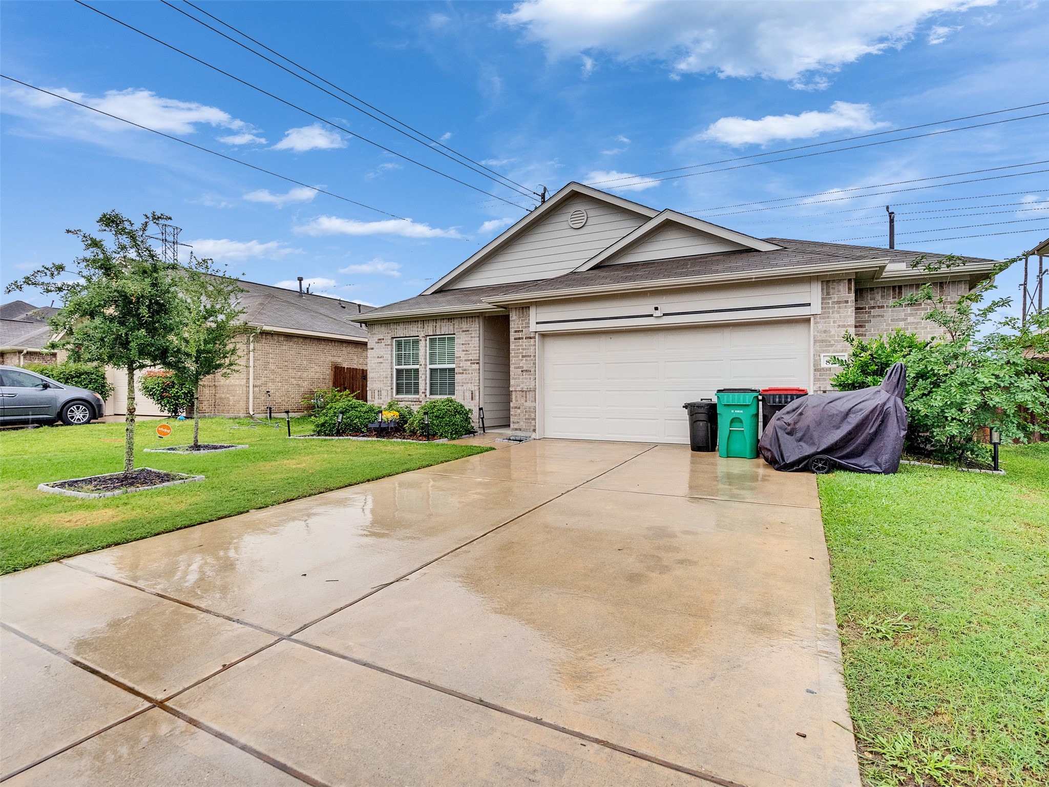 8719 Willet Street Baytown, TX 77521 - Photo 2 of 42 a front view of a house with a yard