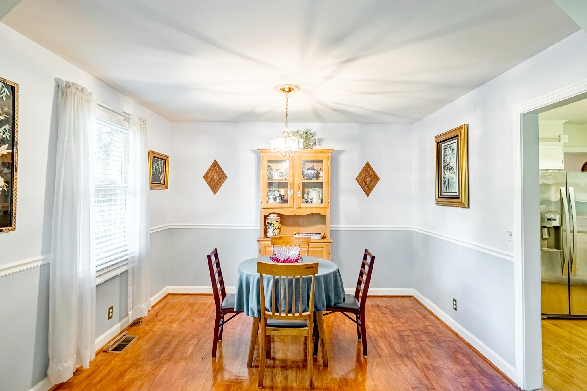 922 Neelys Bend Road Madison, TN 37115 - Photo 15 of 35 a view of a dining room with furniture window and wooden floor