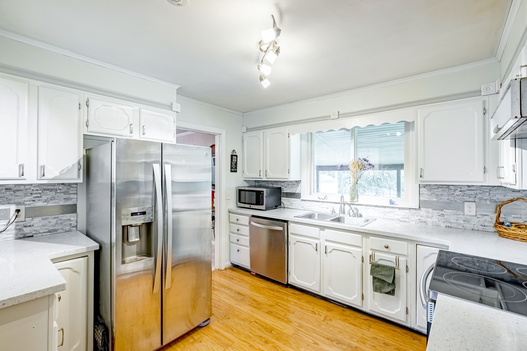 922 Neelys Bend Road Madison, TN 37115 - Photo 18 of 35 a kitchen with stainless steel appliances a refrigerator sink and cabinets