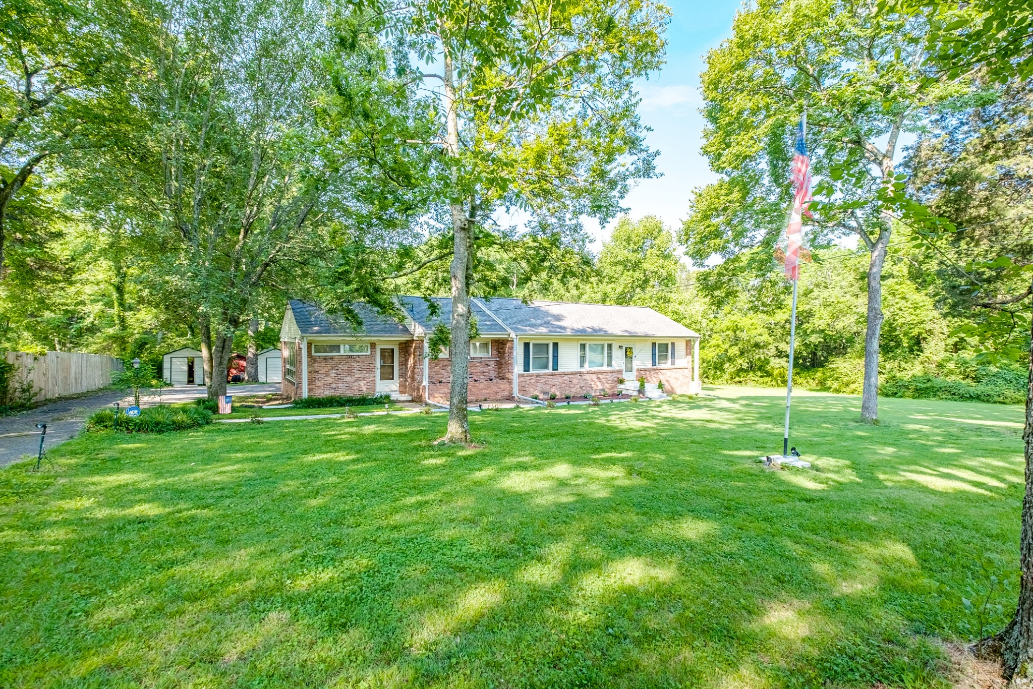 922 Neelys Bend Road Madison, TN 37115 - Photo 2 of 35 a front view of a house with a garden