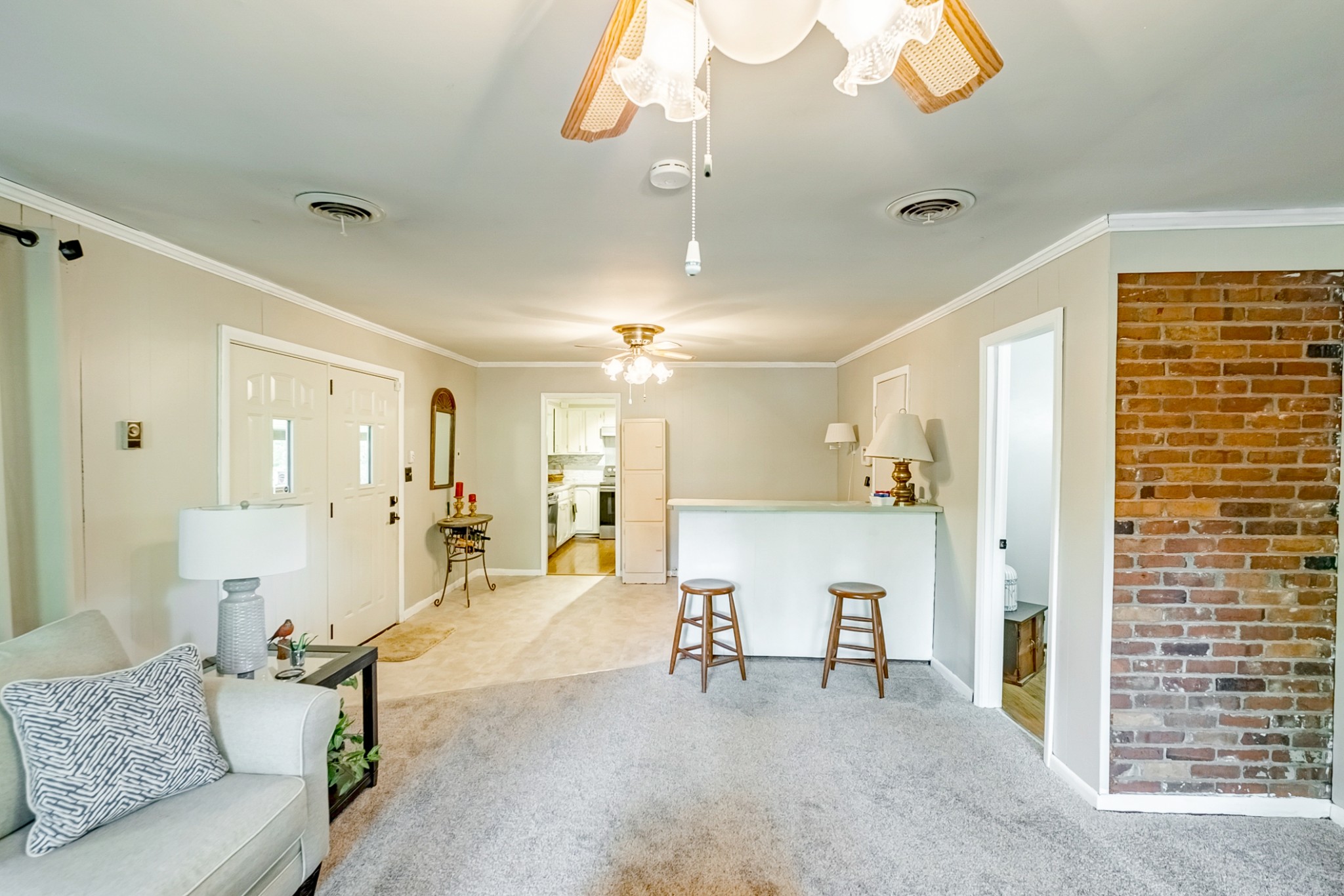 922 Neelys Bend Road Madison, TN 37115 - Photo 25 of 35 a living room with furniture and a chandelier