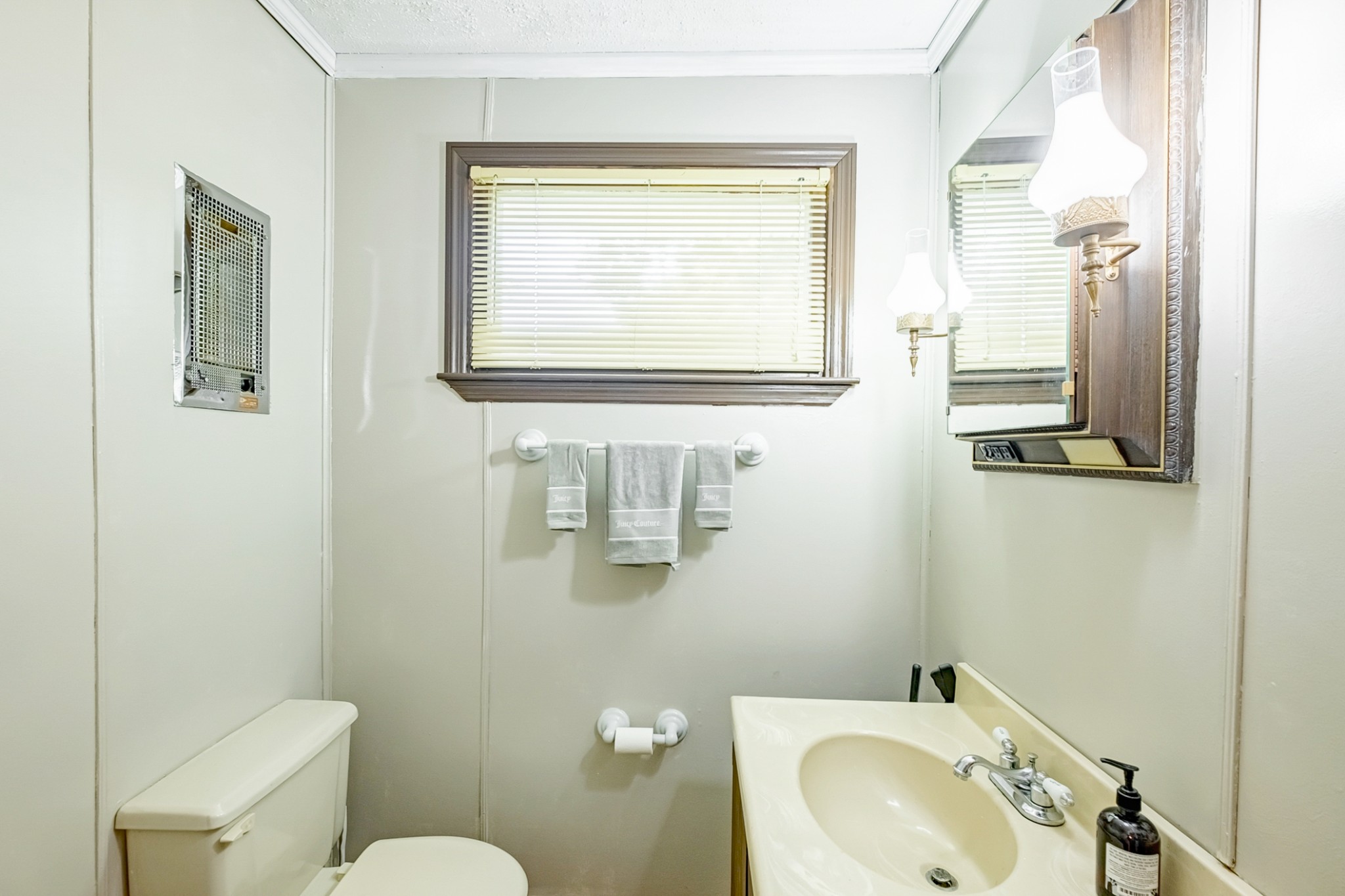 922 Neelys Bend Road Madison, TN 37115 - Photo 26 of 35 a bathroom with a sink mirror toilet and vanity