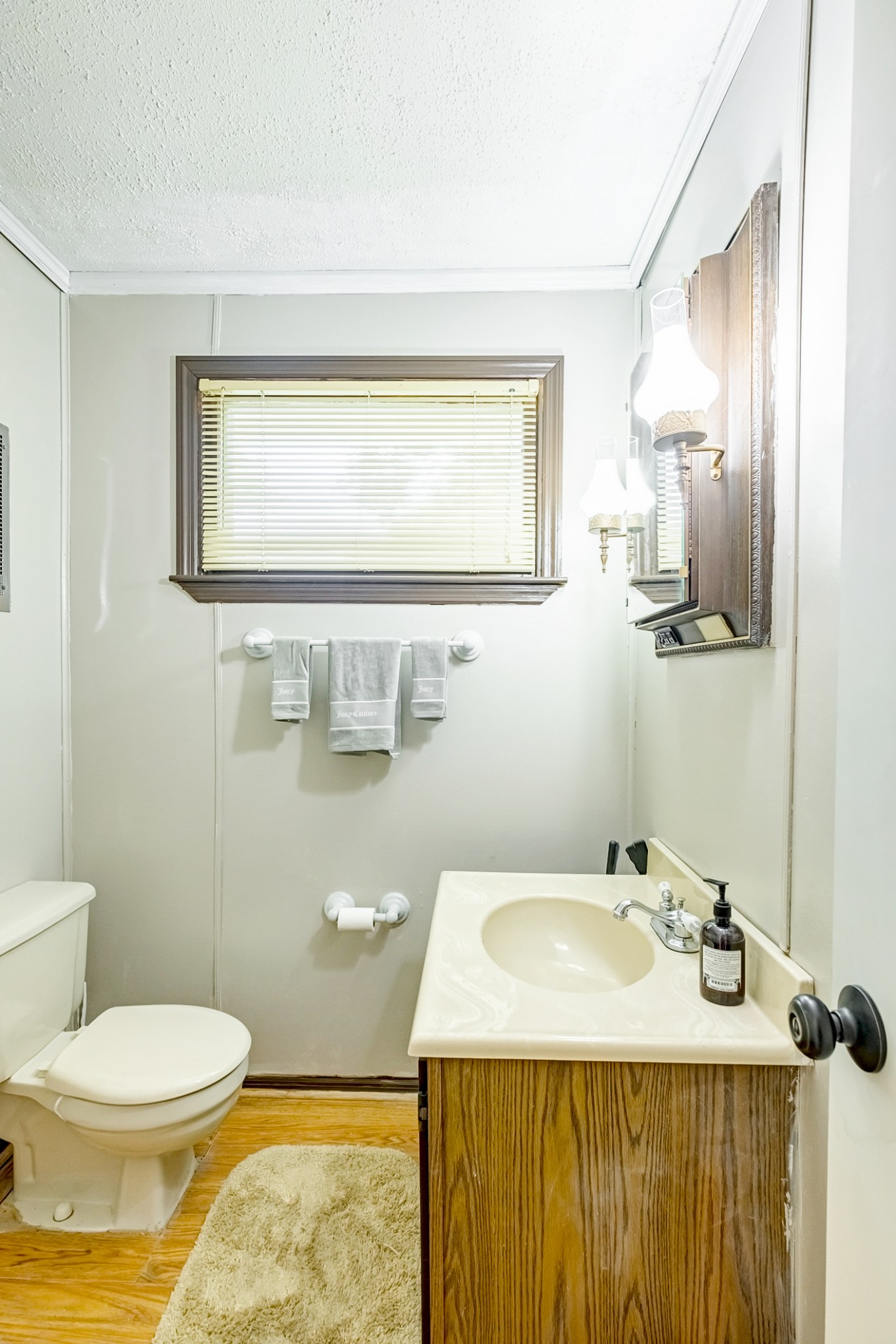 922 Neelys Bend Road Madison, TN 37115 - Photo 27 of 35 a bathroom with a sink toilet and mirror
