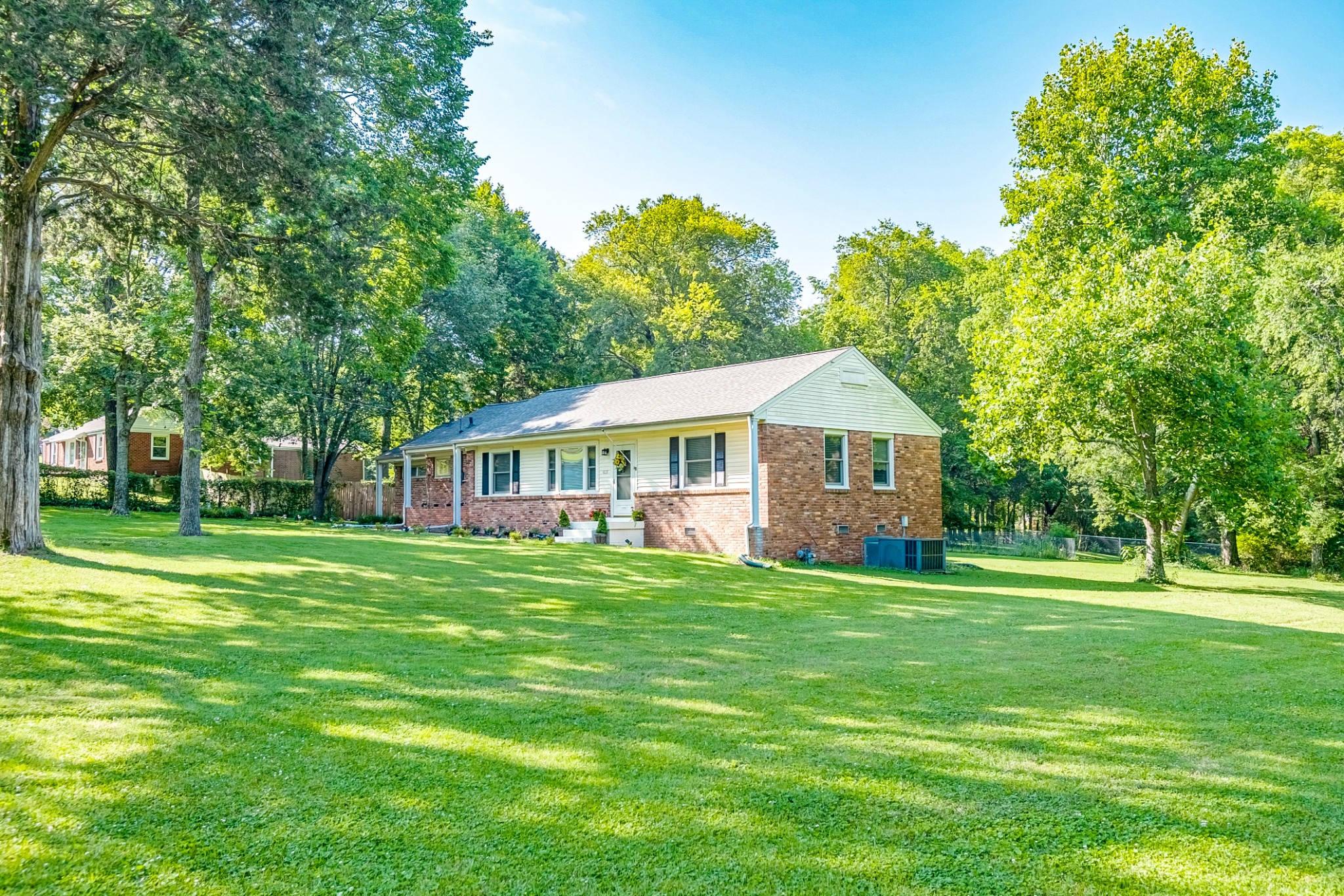 922 Neelys Bend Road Madison, TN 37115 - Photo 3 of 35 a front view of a house with a garden