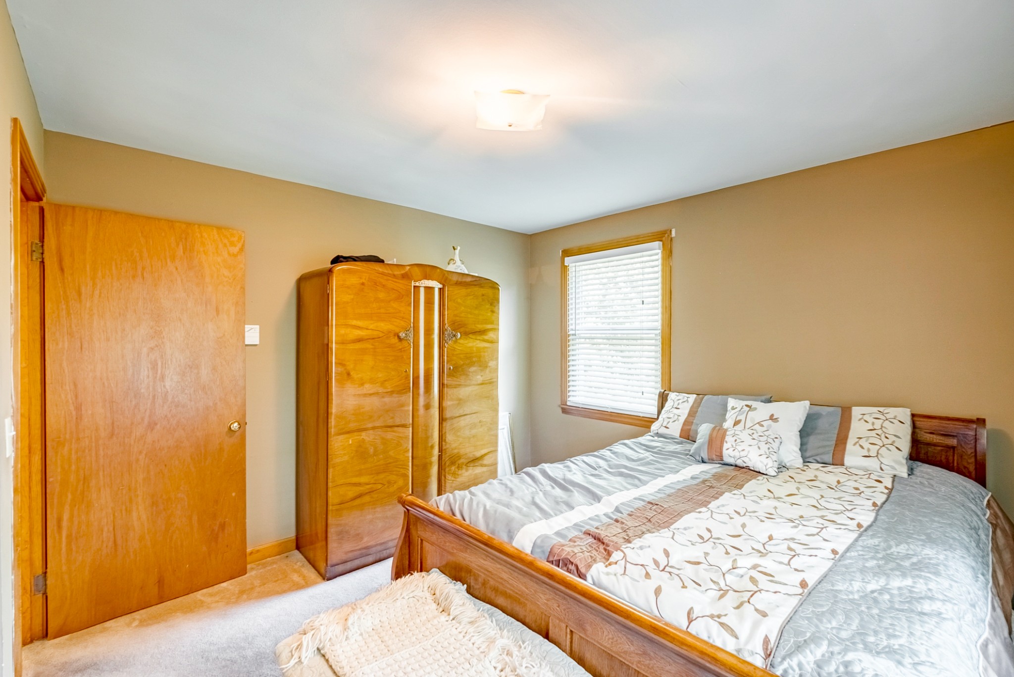 922 Neelys Bend Road Madison, TN 37115 - Photo 10 of 35 a bedroom with a bed and wooden floor