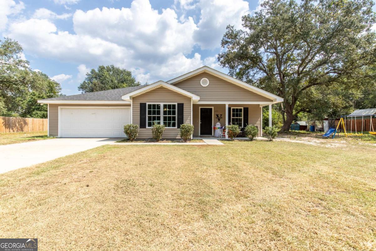 a front view of a house with a yard