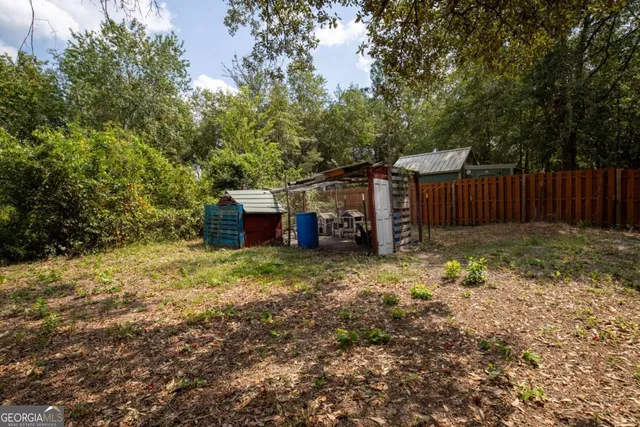 a front view of a house with yard patio and outdoor seating
