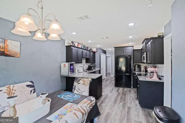 a bed room with a bed mirror and a television