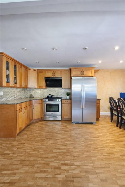 1956 20th Drive Brooklyn, NY 11214 - Photo 13 of 16 a kitchen with stainless steel appliances a sink counter top space cabinets and stainless steel appliances