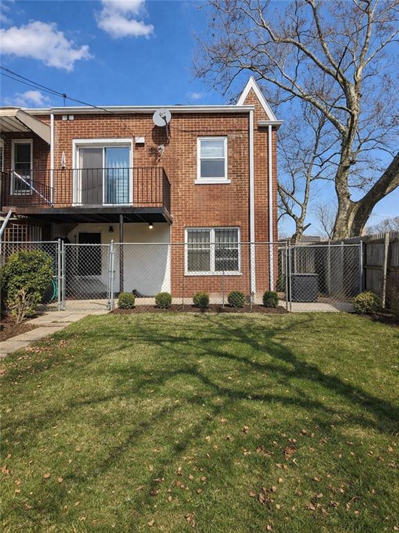 1956 20th Drive Brooklyn, NY 11214 - Photo 16 of 16 a front view of a house with a garden