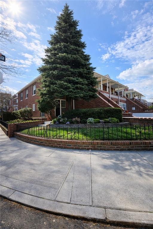 1956 20th Drive Brooklyn, NY 11214 - Photo 2 of 16 a front view of a house with garden