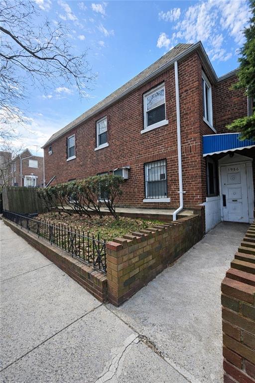 1956 20th Drive Brooklyn, NY 11214 - Photo 3 of 16 a front view of a house with garage