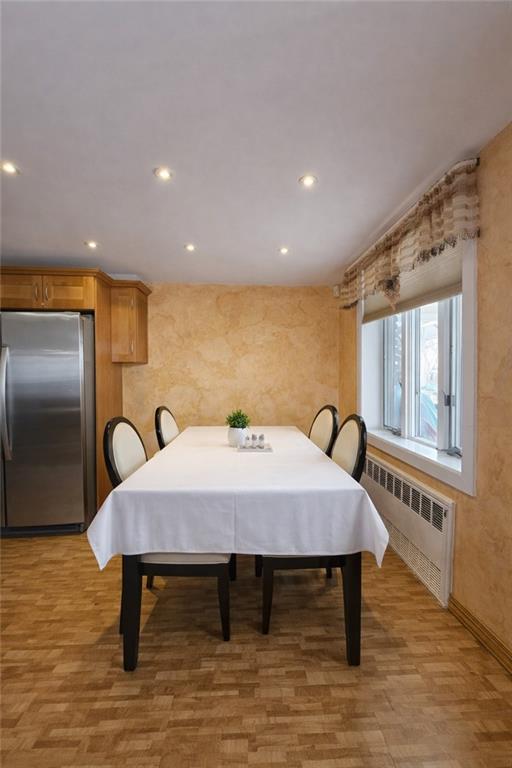 1956 20th Drive Brooklyn, NY 11214 - Photo 10 of 16 a bed sitting in a room next to a window