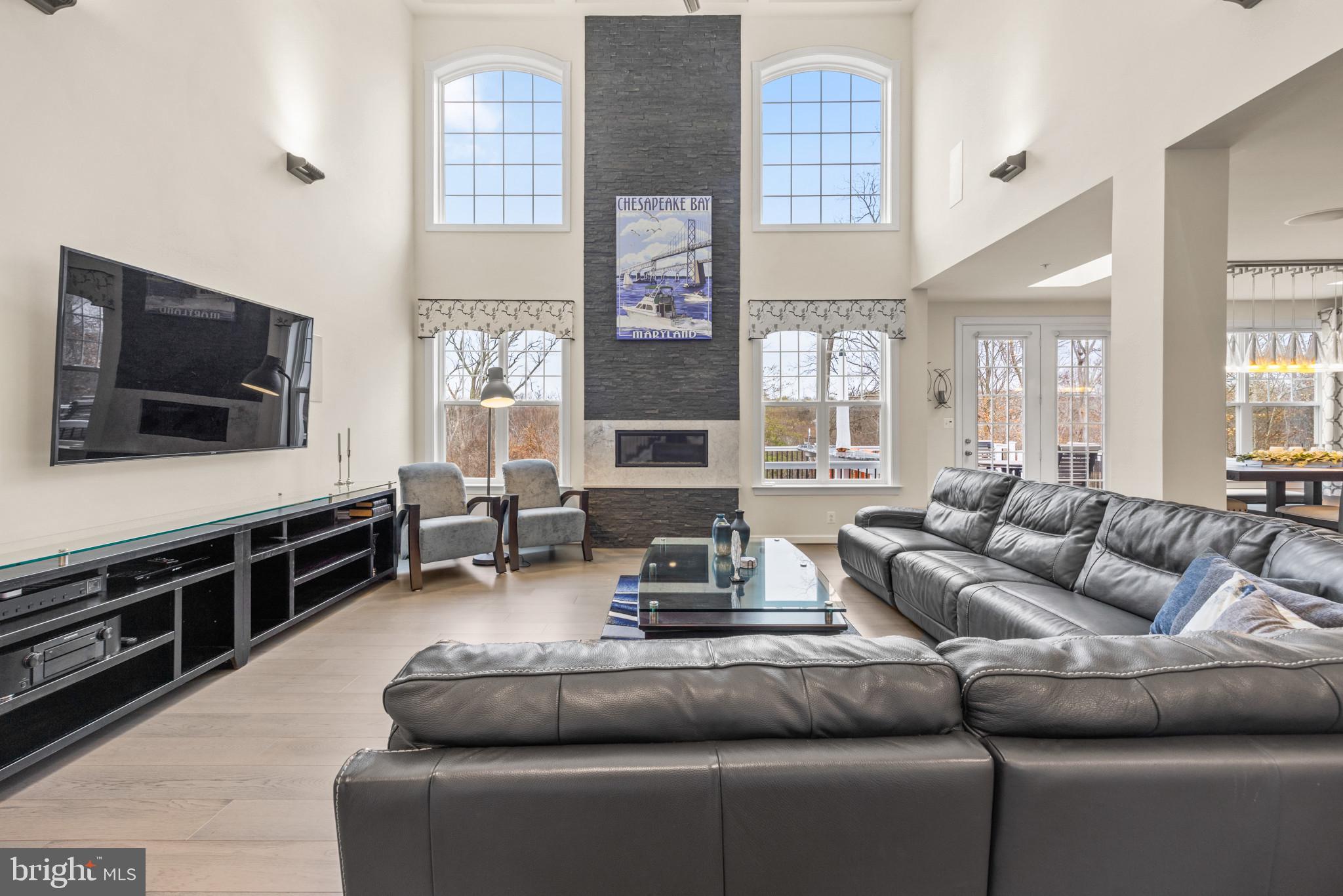 155 Moore Road Arnold, MD 21012 - Photo 7 of 28 Great Room with soaring stone fireplace