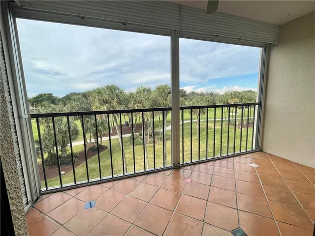 a view of a swimming pool with a table and chairs