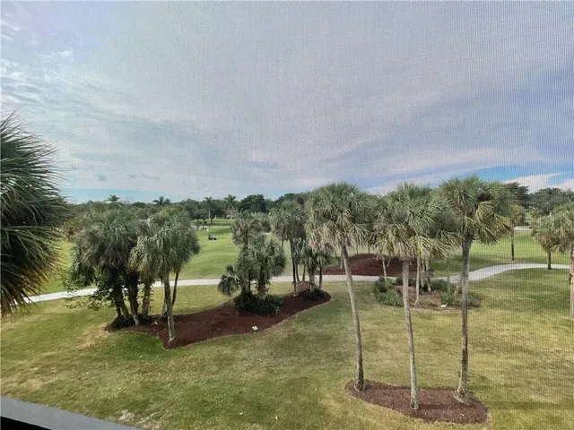 a view of a big playing with a golf course