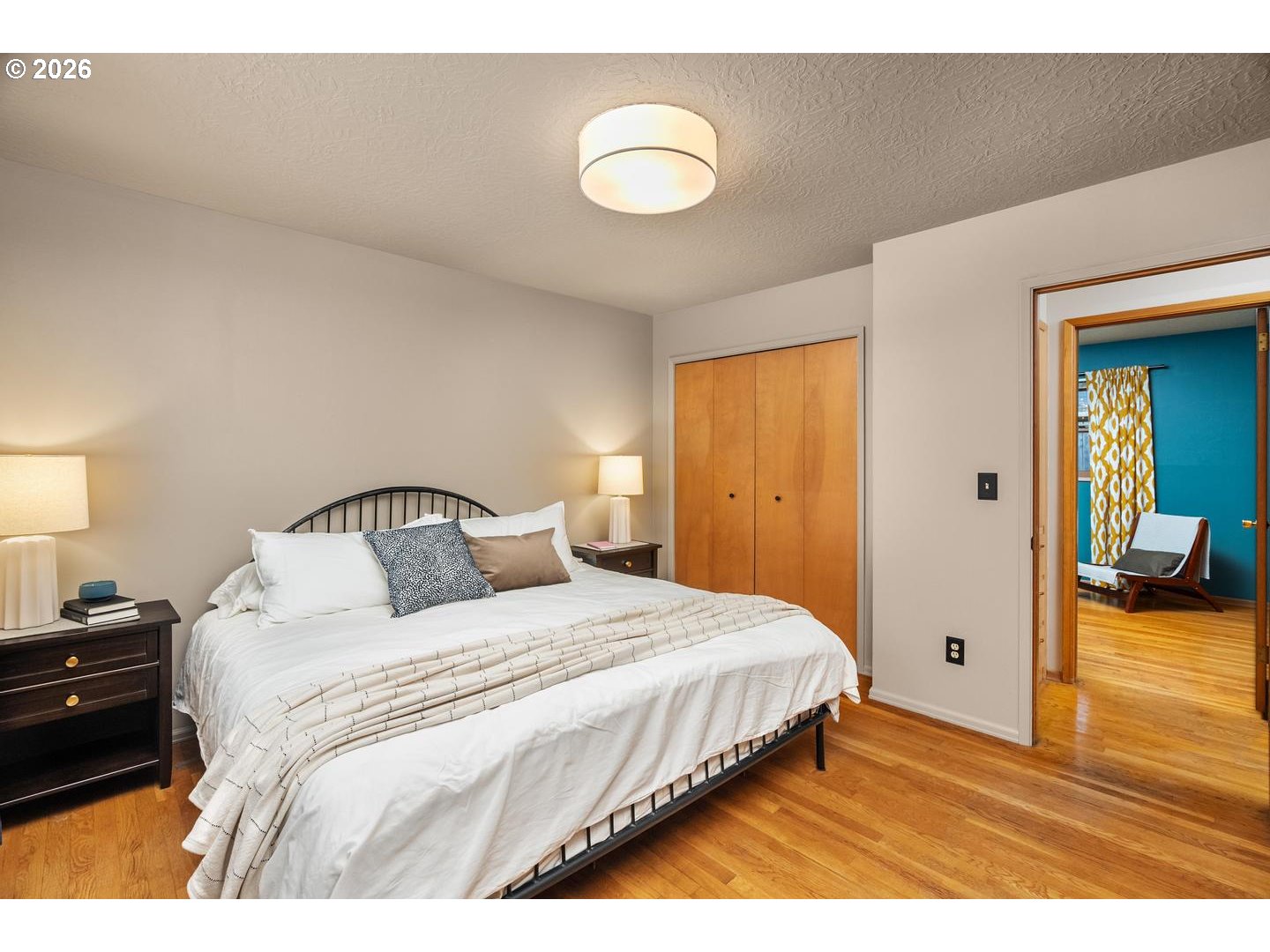 3005 Southwest 113th Avenue Beaverton, OR 97005 - Photo 15 of 30 a bedroom with a bed and a lamp
