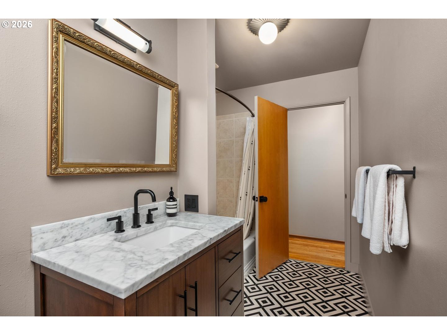 3005 Southwest 113th Avenue Beaverton, OR 97005 - Photo 19 of 30 a bathroom with a sink a vanity and a mirror