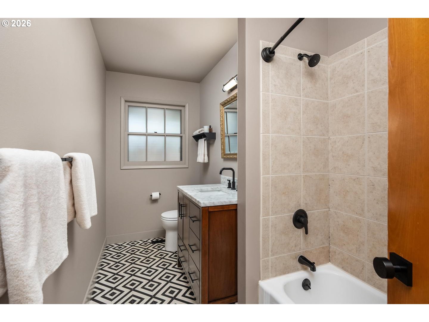 3005 Southwest 113th Avenue Beaverton, OR 97005 - Photo 20 of 30 a bathroom with a sink a toilet a window and shower