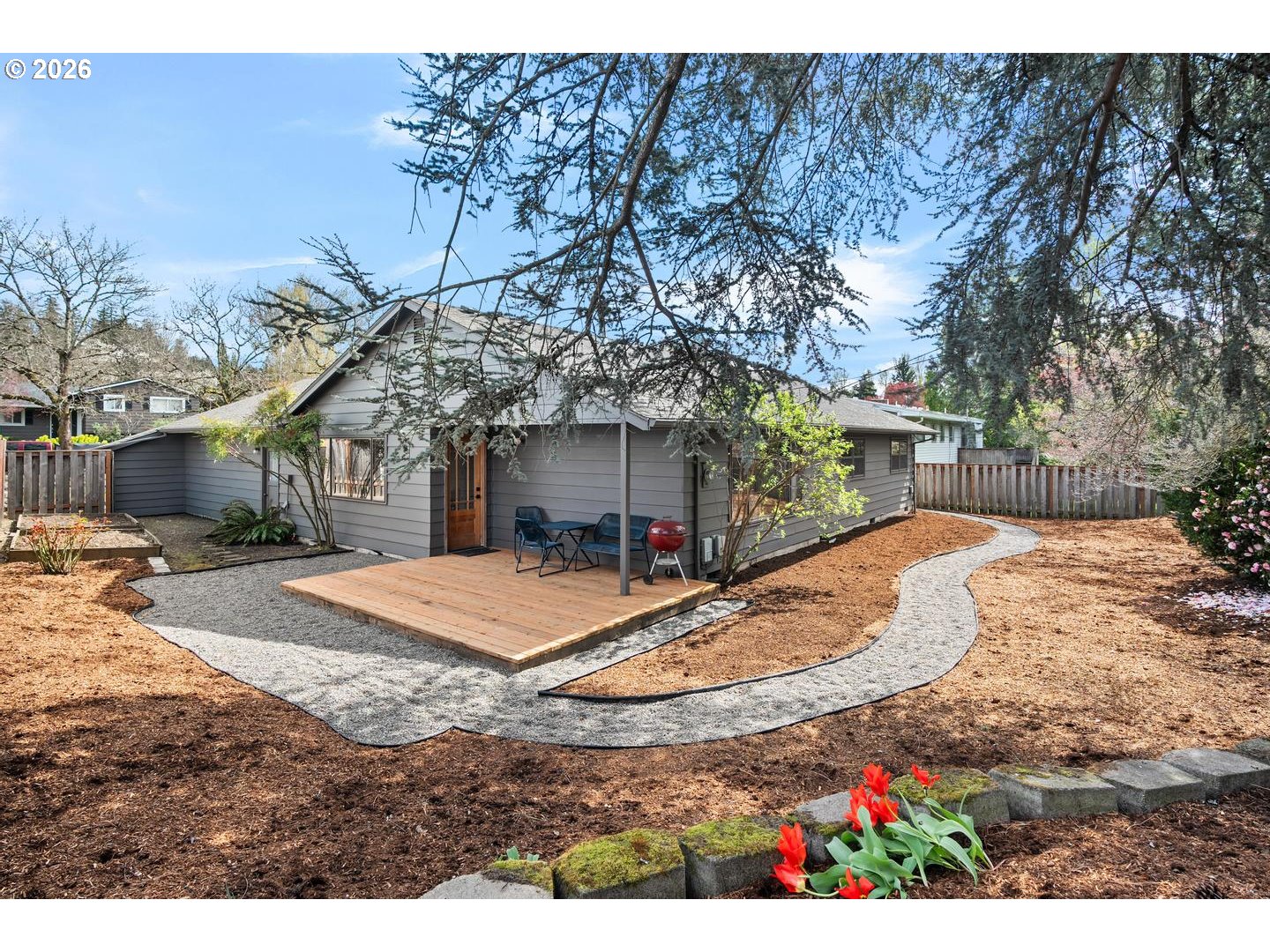 3005 Southwest 113th Avenue Beaverton, OR 97005 - Photo 25 of 30 a view of a white house with a yard and pathway