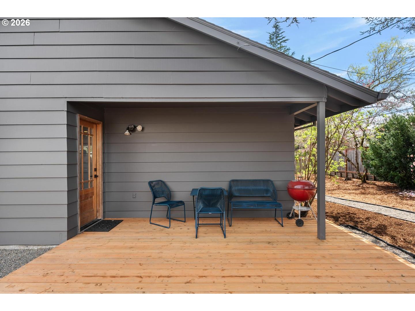 3005 Southwest 113th Avenue Beaverton, OR 97005 - Photo 26 of 30 a backyard of a house with wooden floor and outdoor seating