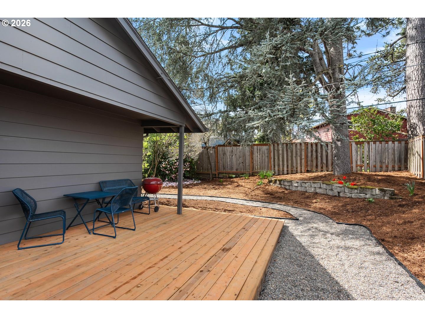 3005 Southwest 113th Avenue Beaverton, OR 97005 - Photo 27 of 30 a view of a patio with a table and chairs