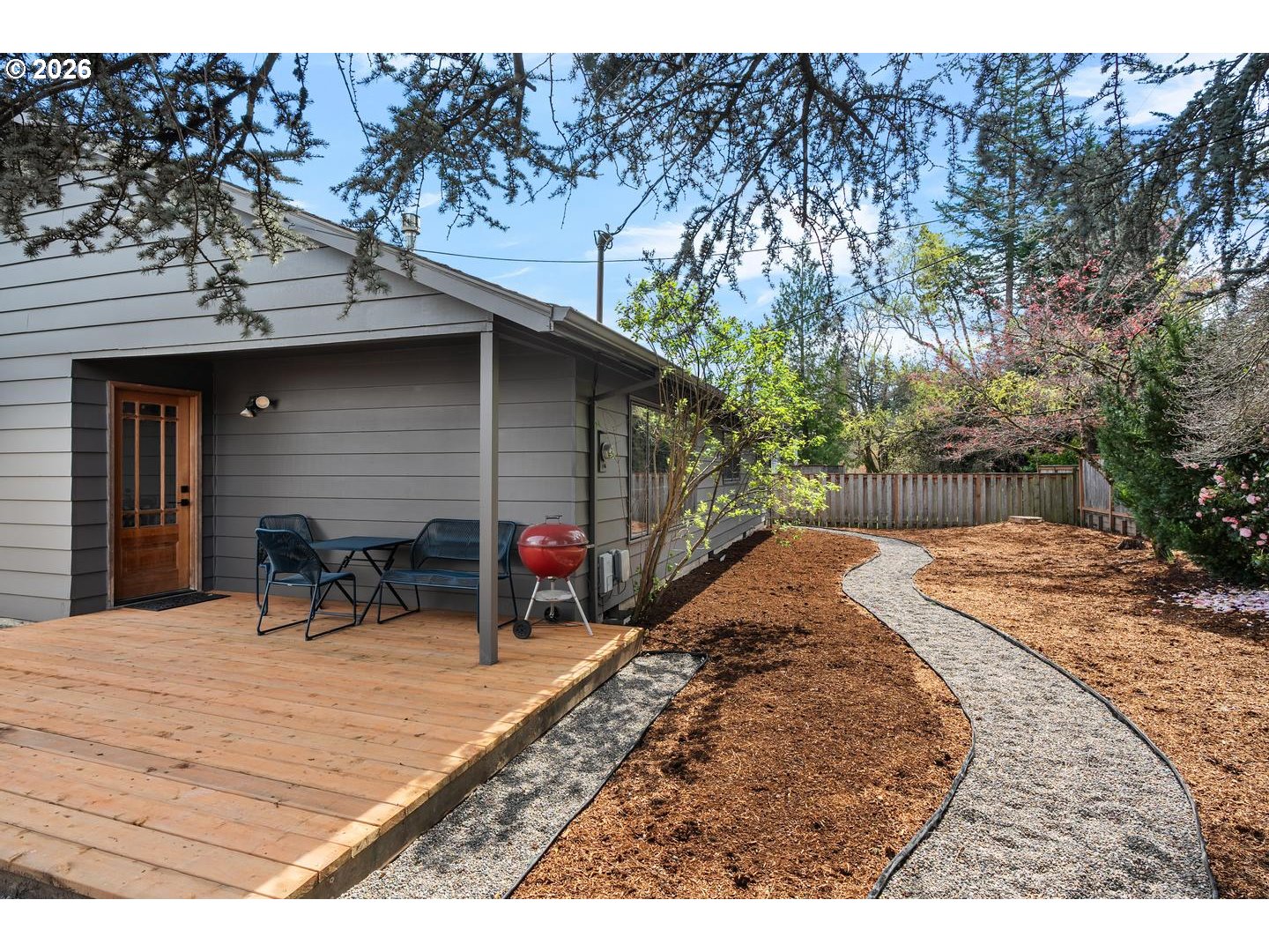 3005 Southwest 113th Avenue Beaverton, OR 97005 - Photo 28 of 30 a view of a backyard with table and chairs and a barbeque