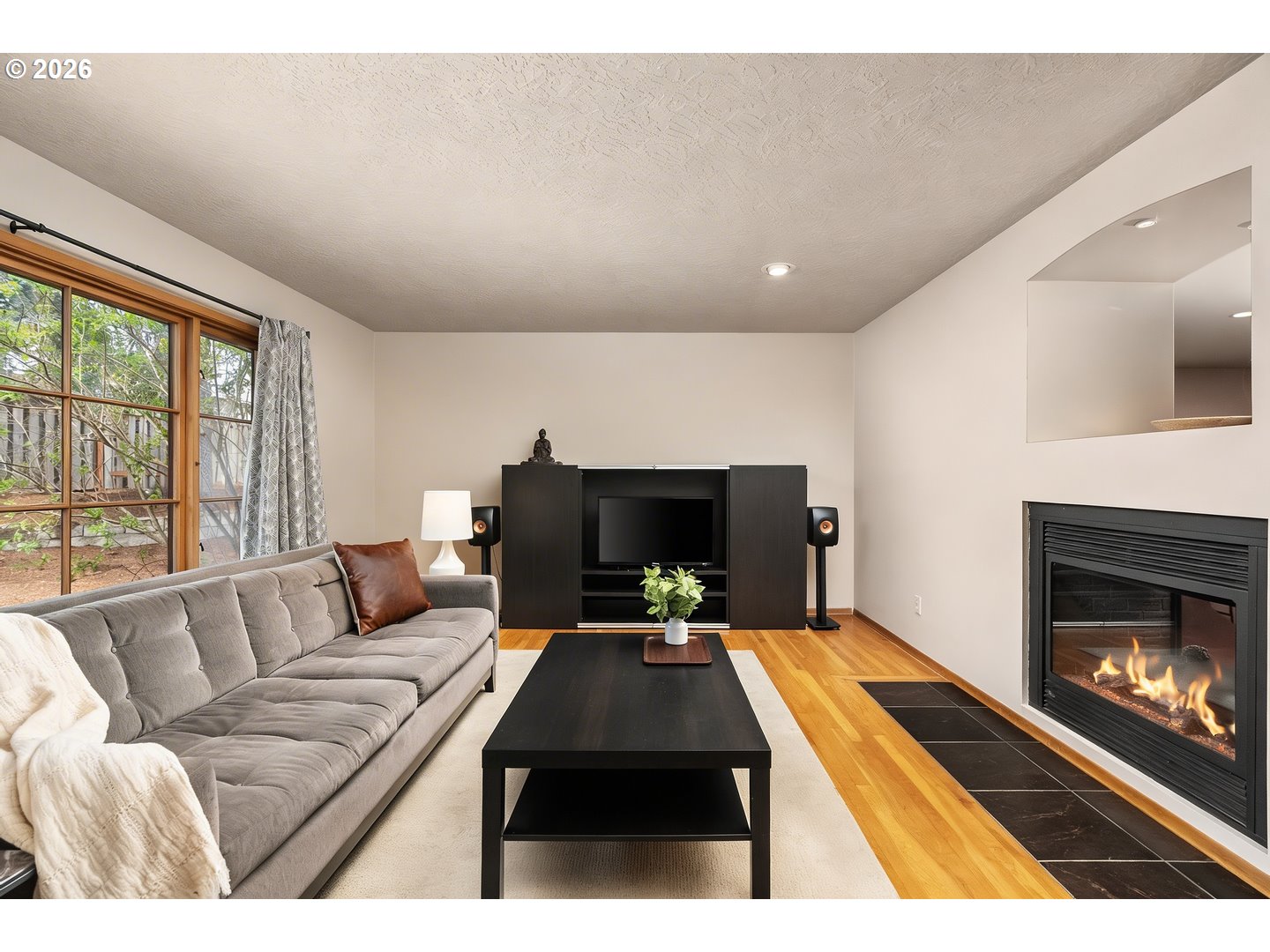 3005 Southwest 113th Avenue Beaverton, OR 97005 - Photo 5 of 30 a living room with furniture and a fireplace